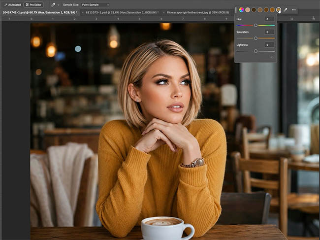 Blonde woman in an orange sweater at a cafe table, a difficult color change in Photoshop