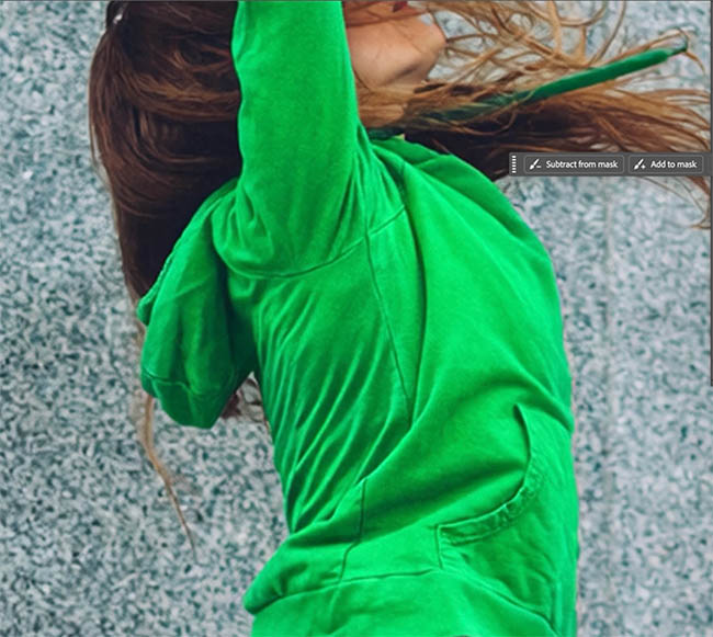 Close up of the green hoodie from Prompt to Edit with smoothed fabric texture
