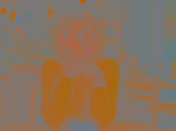 Color only view of the cafe portrait showing orange tones in the sweater, skin, hair and background